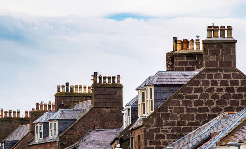 Party Wall surveyors East London - British street rooftops with chimneys