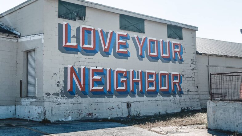 Building with love your neighbour graffiti