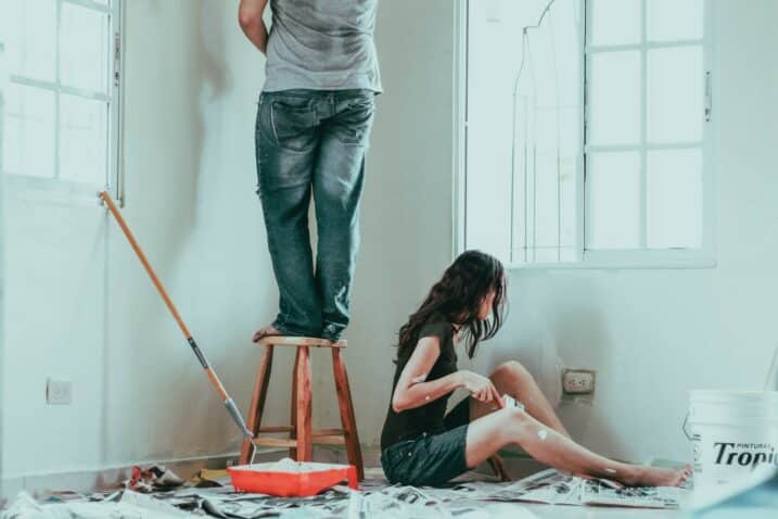 couple painting the wall